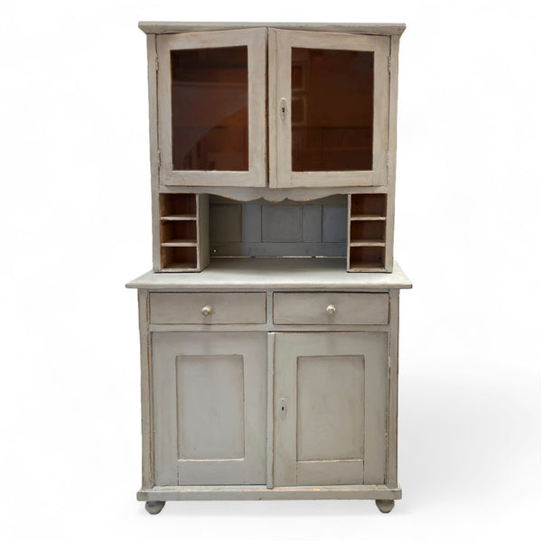 Light gray blue painted vintage cabinet hutch with two bottom cabinets and drawers. Two window display cabinets on the top. 