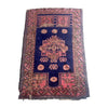 Distressed vintage Turkmen accent rug with pink border and medallion on blue background