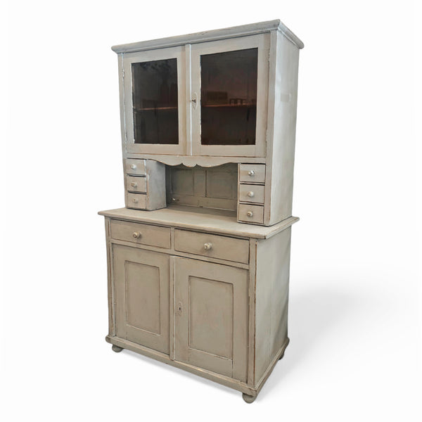 Light gray blue painted vintage cabinet hutch with two bottom cabinets and drawers. Two window display cabinets on the top.