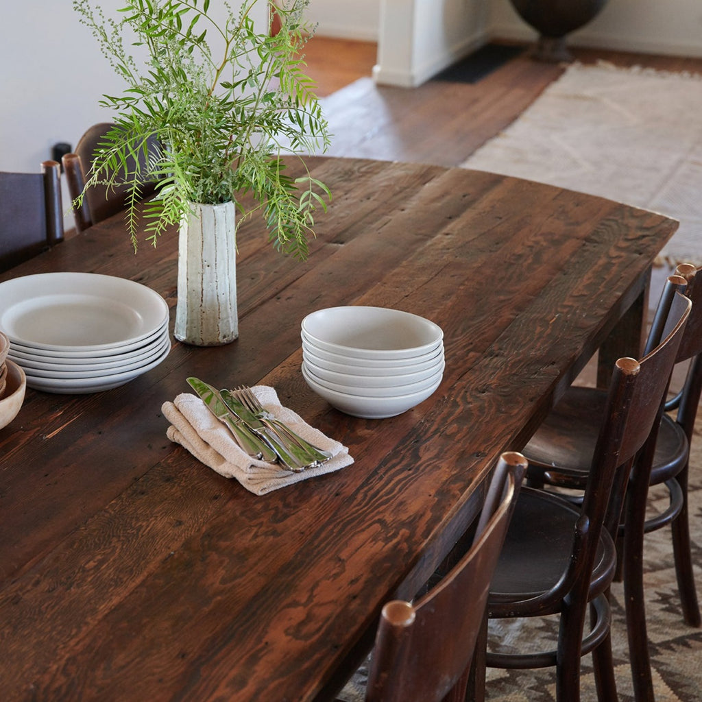 Rustic design inspiration with reclaimed wood table and antique thonet chairs.