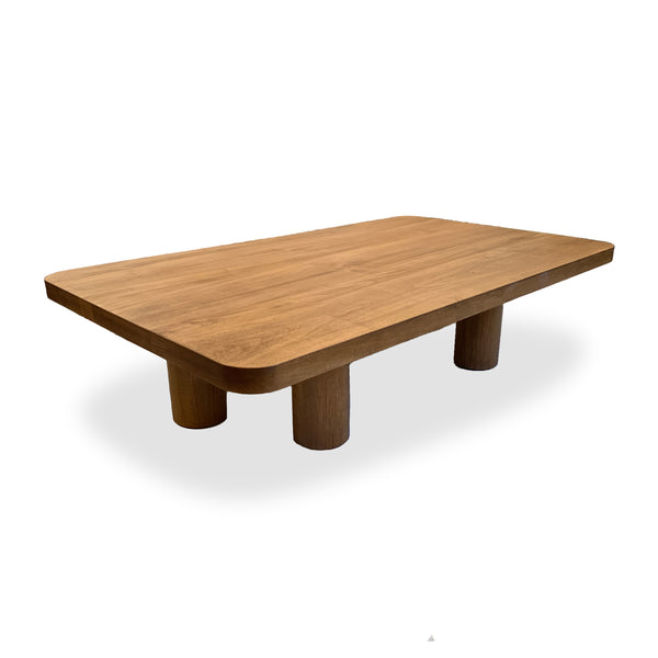 Sustainable custom modern coffee table shown in chestnut wood stain with cylinder legs and rounded corners