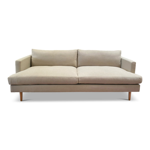 Mid century inspired sofa with wood pin legs and deep cusions.