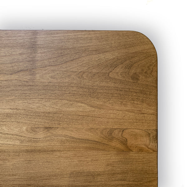 Close up of rounded coffee table corner made out of hardwood in los angeles