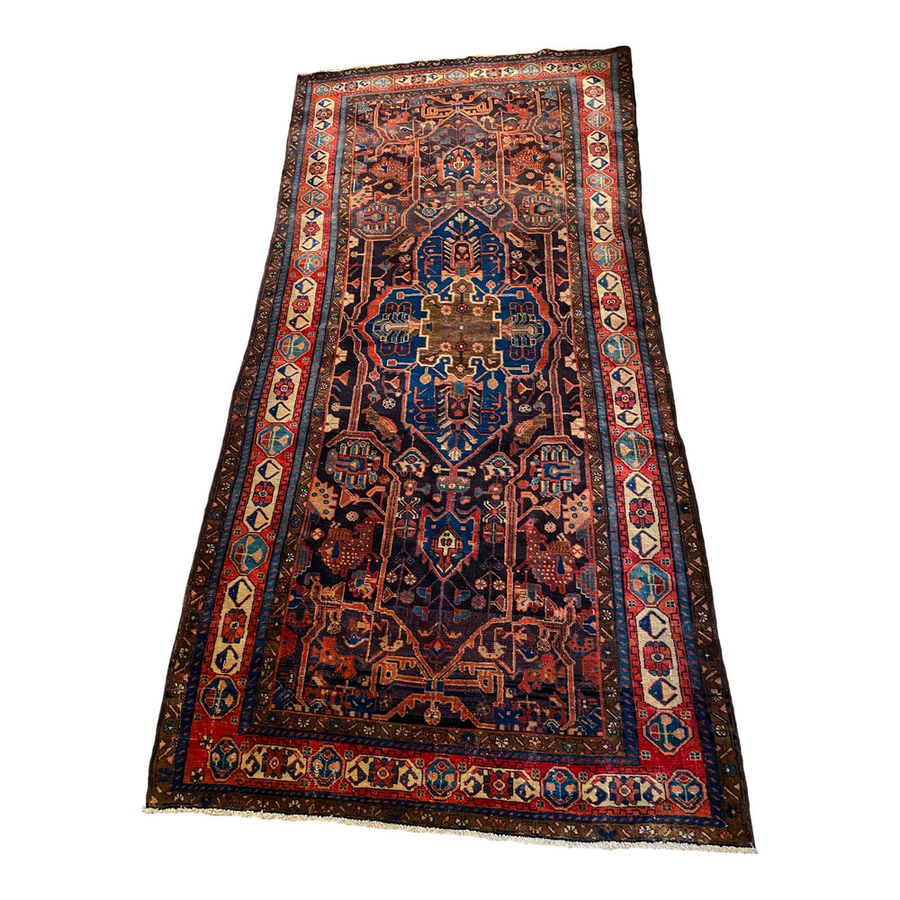Ornate Kurdish area rug in rich jewel tones
