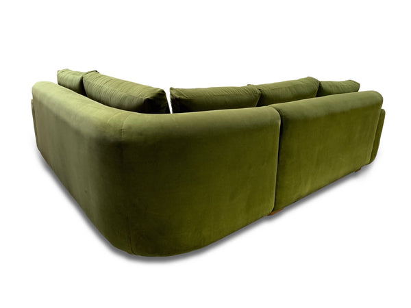 Curve backed sectional sofa with rounded corners and custom cusions