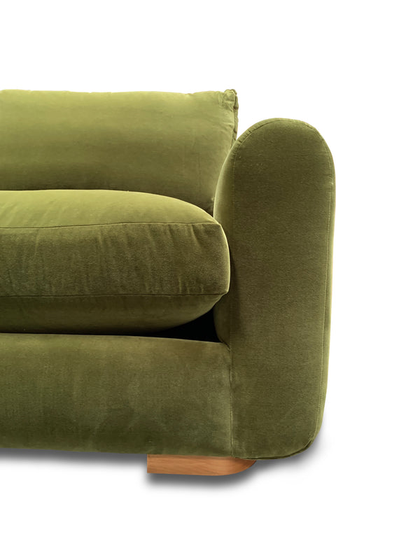 Close up of rounded sofa arm and extra plush down alternative seat cushion