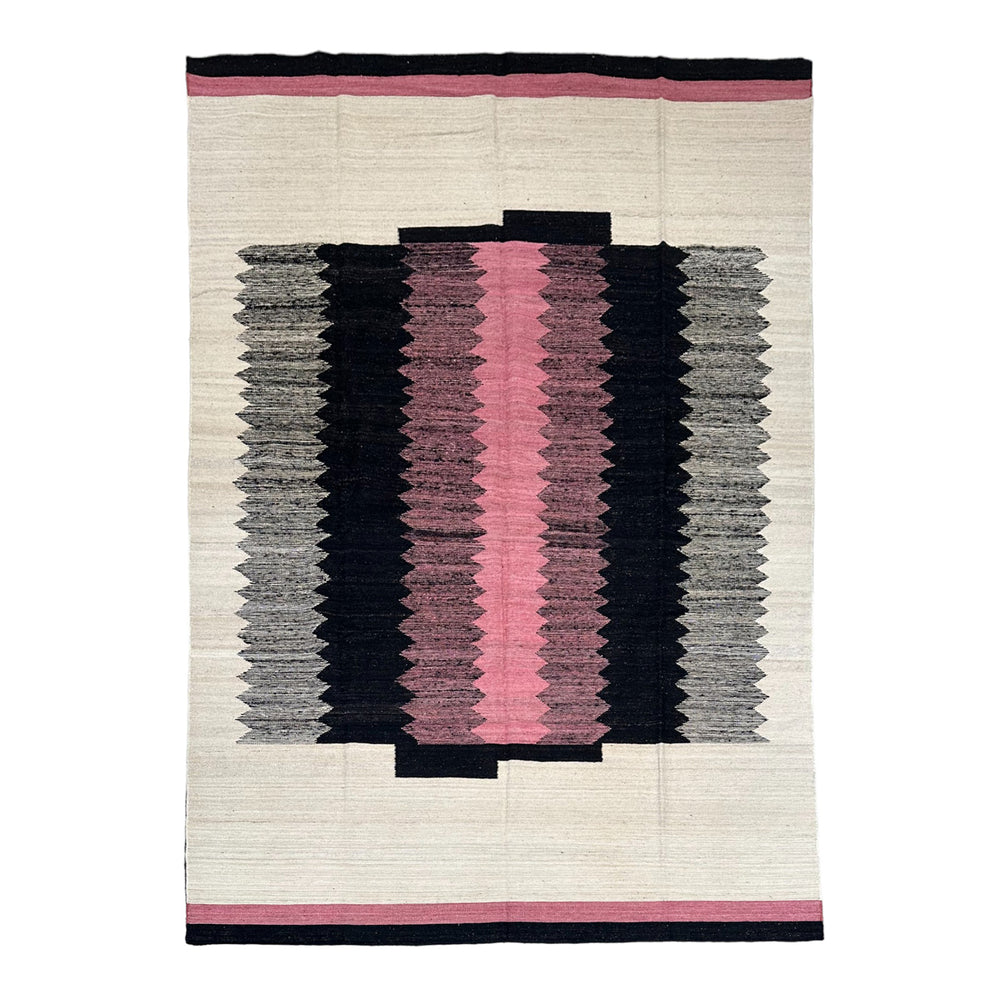 pink black and cream colored flat weave kilim rug