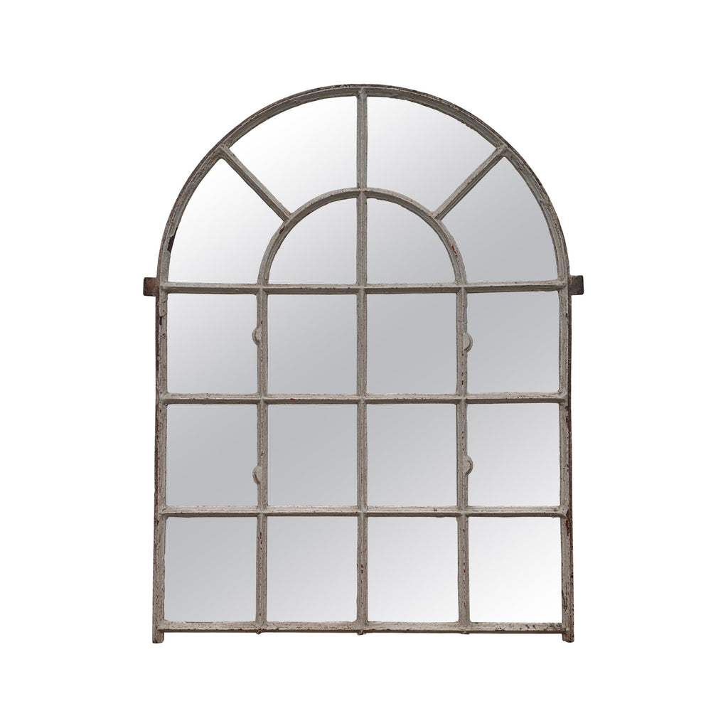 Imagine an old, rustic window taken from a vintage home and repurposed into a mirror. The mirror has an arched top and is divided into multiple square sections by thin, aged wooden frames. The wood is weathered and has a textured, slightly rough surface, giving it a historic and antique feel. The piece feels sturdy and has a timeless quality, blending functionality with decorative charm.