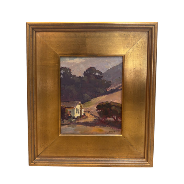 This painting portrays a quiet, rural setting with rolling hills and a small house nestled at the base of large, wind-swept trees. The light appears soft, casting gentle shadows over the hills, suggesting either late afternoon or early evening. The scene feels peaceful and calm, with the wind likely rustling through the trees and across the landscape, evoking the feel of open space and nature's quiet beauty.