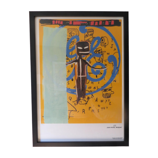 Basquiat lithrograph with blues, yellows, & blacks. White mat in a black frame.