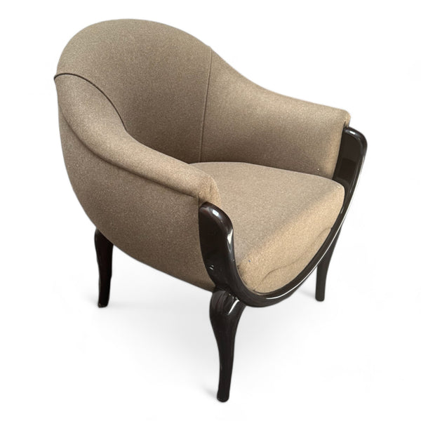 Beige fabric accent chair with rounded frame and walnut legs.