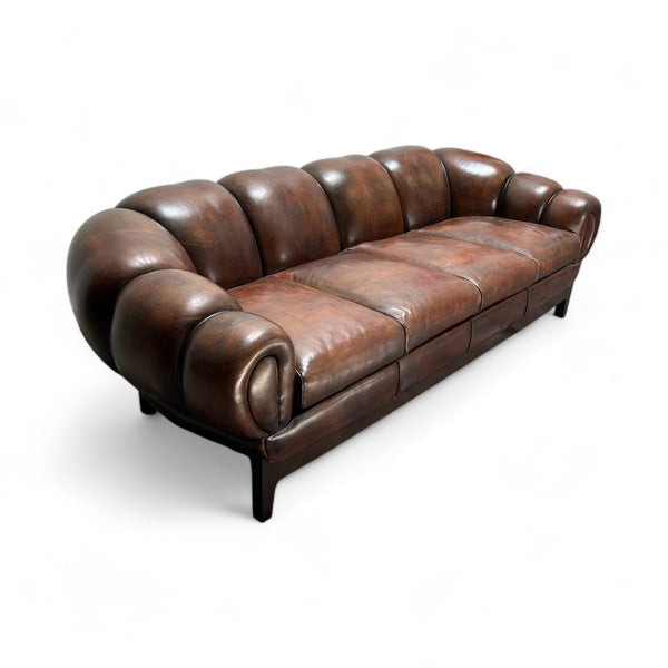 Tufted rich brown leather sofa