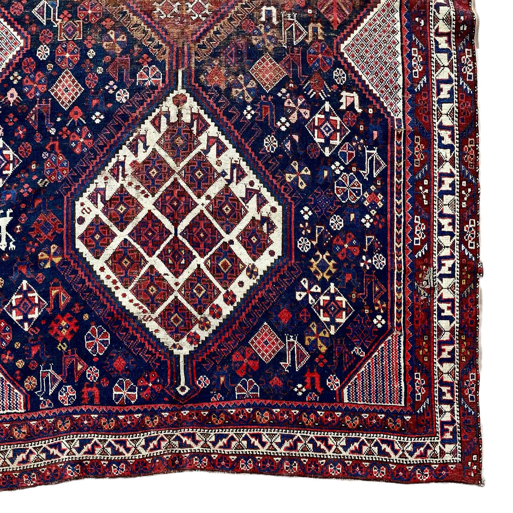Antique jewel toned persian rug with ornate decoration
