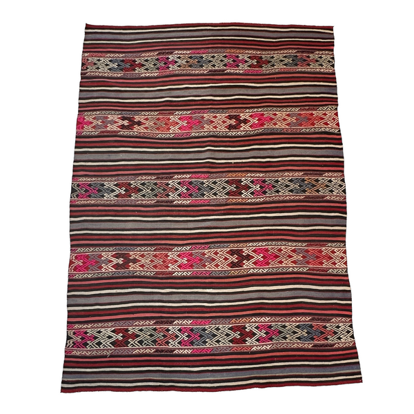 turkish wool area rug with red, pink, grey and black details