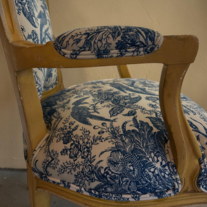 deKor vintage armchair featuring blue and white toile fabric upholstery with floral and bird patterns on a wood frame