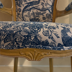 deKor vintage chair featuring blue and white toile fabric with floral and bird patterns on a carved wooden frame