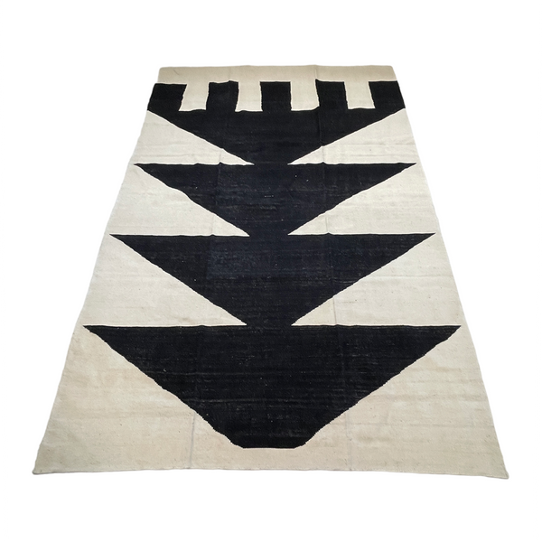 cream kilim rug with black triangle motif