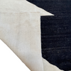 cream flat weave rug with black geometric design
