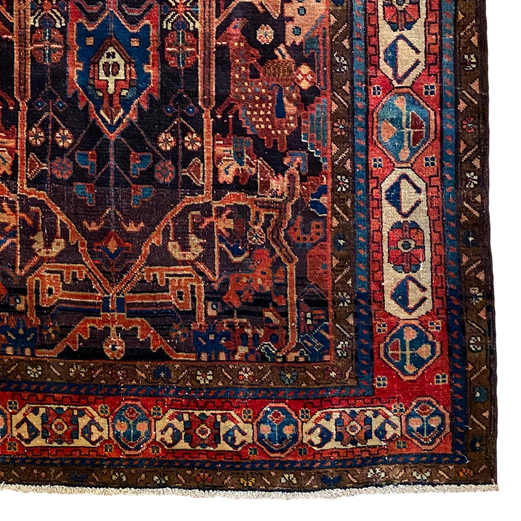 Ornate Kurdish area rug in rich jewel tones