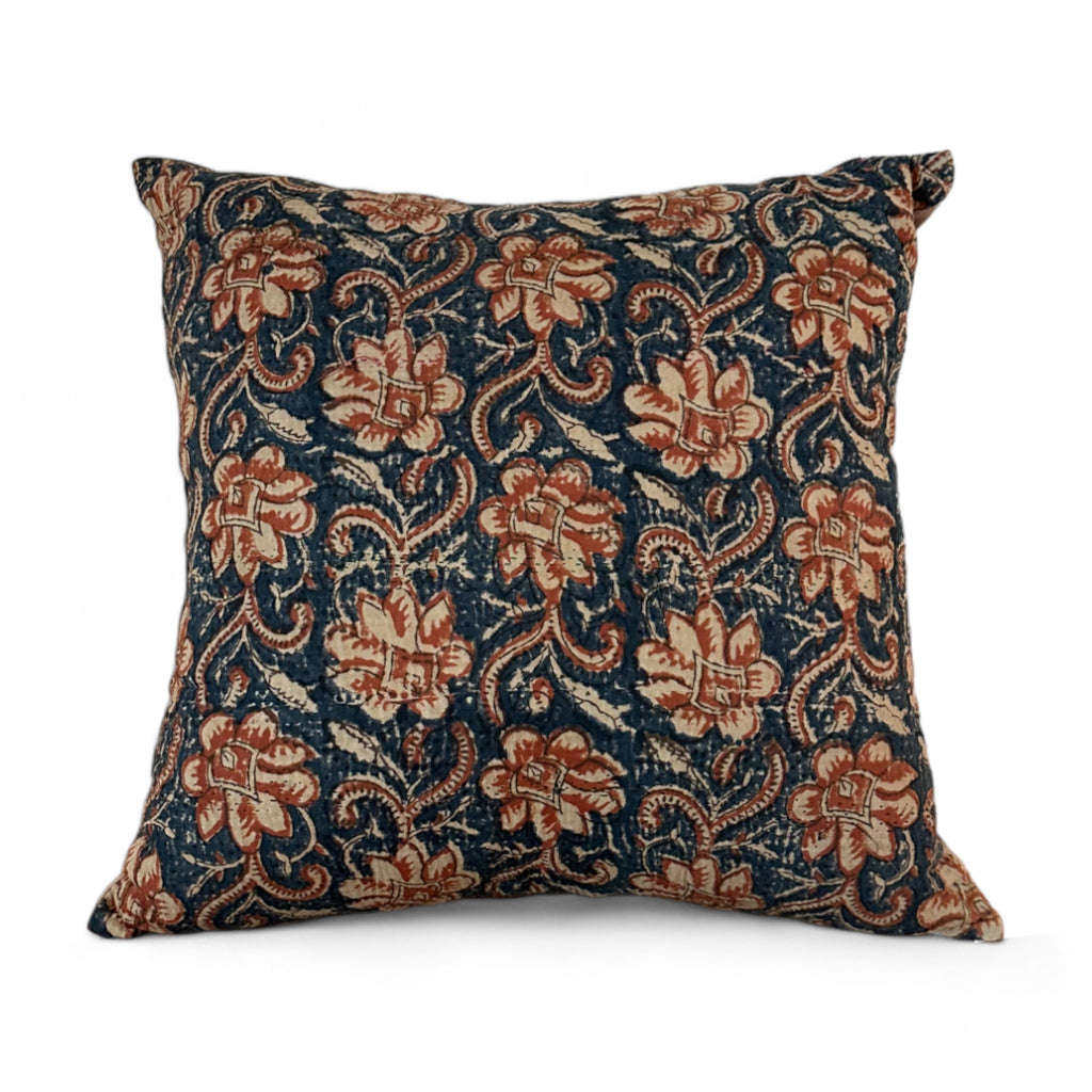 Vintage fabric pillow with blue and rust orange floral design