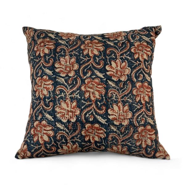 Vintage fabric pillow with blue and rust orange floral design