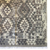 Neutral geometric patterned kilim accent rug