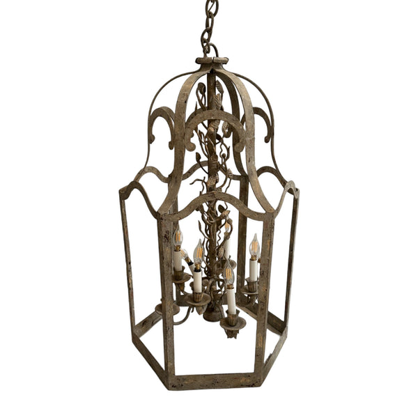 Wrought iron lantern style chandelier with leaf details. 