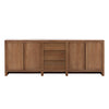 This credenza is a long, rectangular piece of furniture made of smooth, solid wood with a natural finish. The front of the credenza has a minimalist design, featuring four large cabinet doors on either side and three smaller drawers in the center. The overall look is clean and modern, with subtle, precise lines that give it a sense of refined simplicity. The wood has a slightly warm tone, adding a touch of natural beauty to the piece.