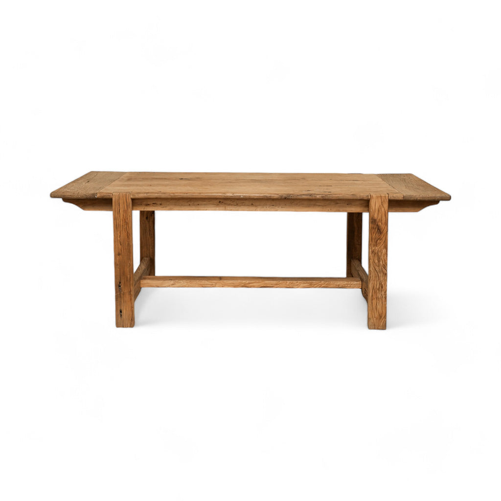 Reclaimed elm wood with a natural finish, this rectangular dining table adds a touch of warmth and character to any space.