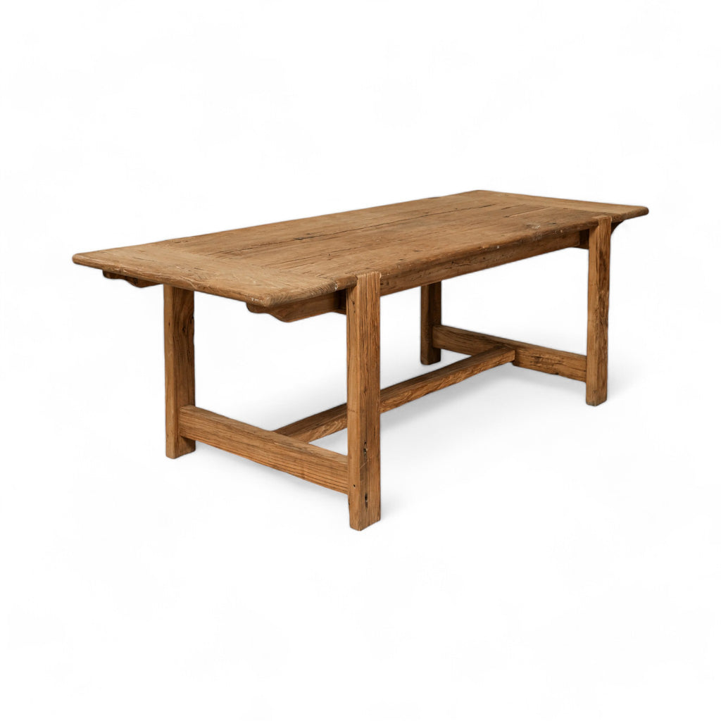 Reclaimed elm wood with a natural finish, this rectangular dining table adds a touch of warmth and character to any space.