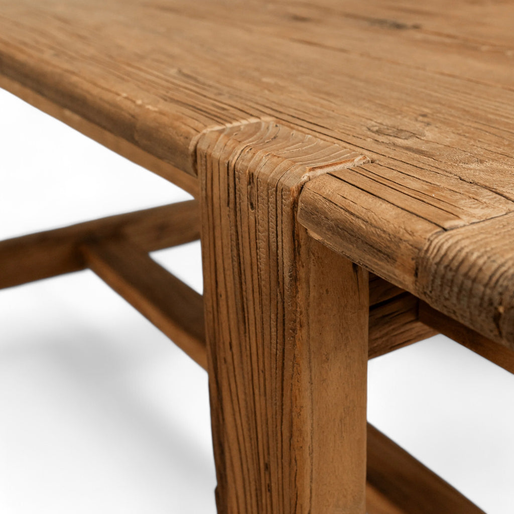 Reclaimed elm wood with a natural finish, this rectangular dining table adds a touch of warmth and character to any space.