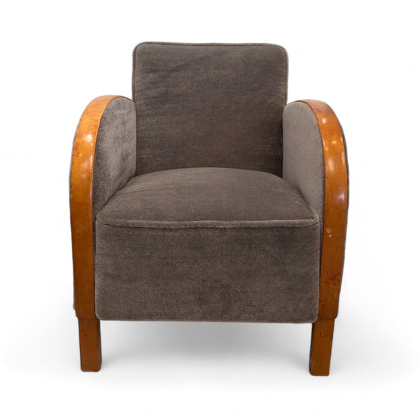 Two muted blue gray mohair armchairs with wood trim on arms.