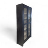 Vintage wooden display cabinet painted black with glass windows and charming black handles. 