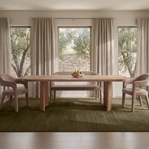 deKor camel polyester barrel back dining bench with iron frame in a bright, modern dining room setting.