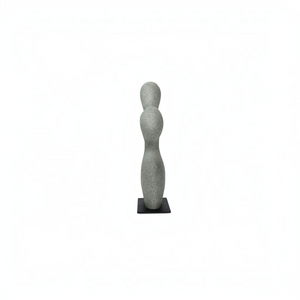 deKor freeform modernist sculpture in charcoal grey ecomix on a thin black metal base, side view