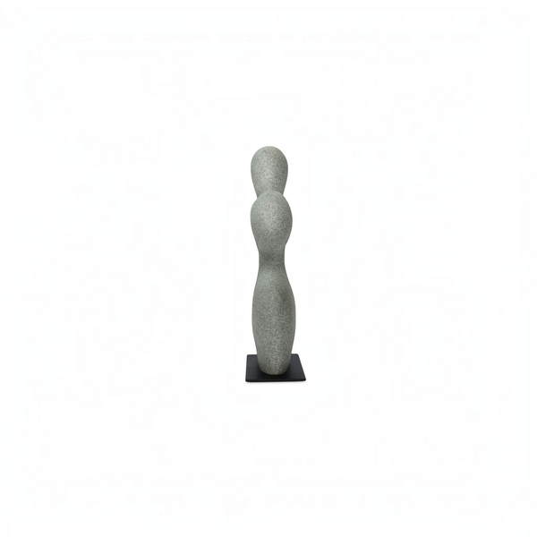deKor freeform modernist sculpture in charcoal grey ecomix on a thin black metal base, side view