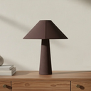 deKor cotton-wrapped table lamp in dark brown with a minimalist geometric silhouette on a wooden console table.