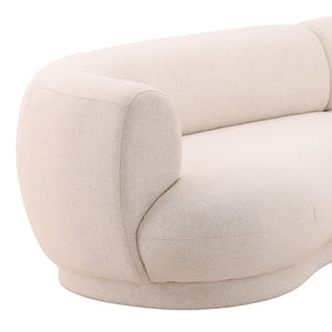 deKor cream performance linen blend chaise sectional with a modern curved silhouette and plush deep seating