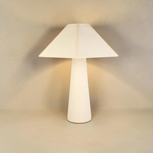deKor Cream Gigi table lamp with a minimalist conical base and a wide, angular shade in a soft matte finish.