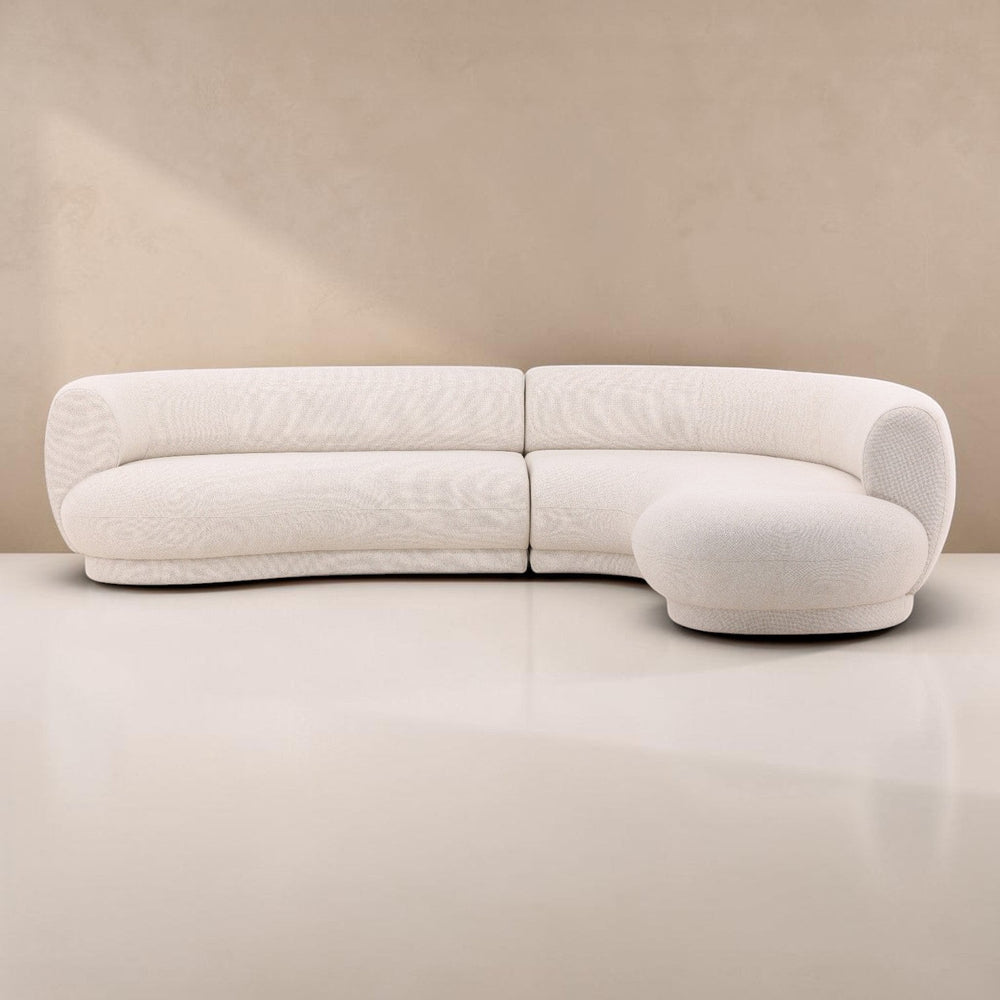 deKor performance linen blend cream chaise sectional with a modern curved silhouette and right-arm facing design.