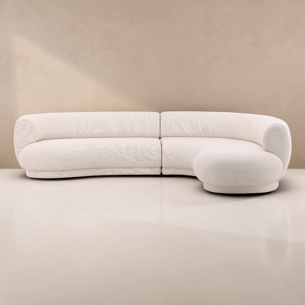 deKor performance linen blend cream chaise sectional with a modern curved silhouette and right-arm facing design.