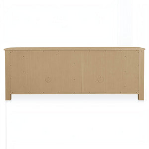 Back view of the deKor Curved-Corner Sideboard in natural oak veneer with two circular cable management cutouts.