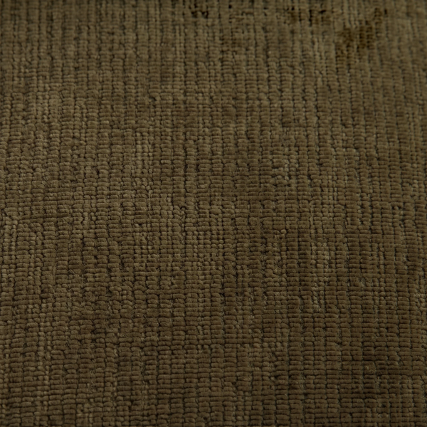Close-up of dark green performance polyester fabric texture on a deKor modular chair.