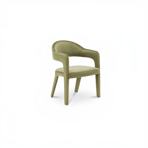 deKor barrel back dining chair in green velvet with a continuous curved frame and comfortable padded seat