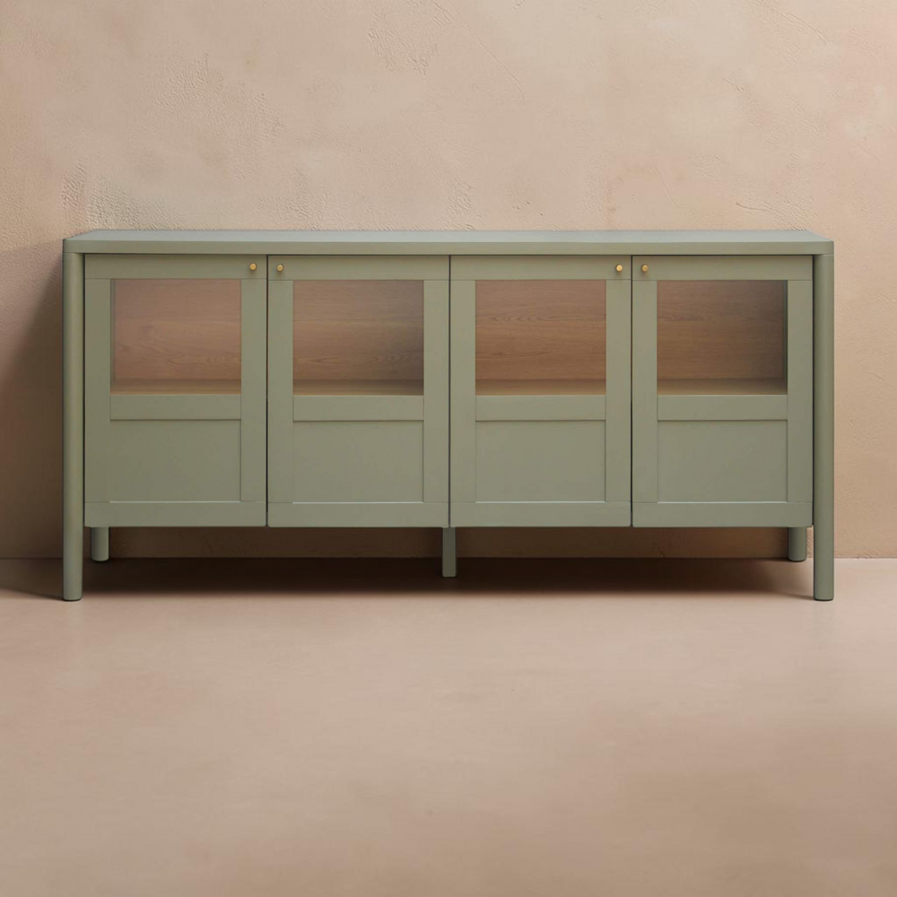 deKor Hannah sideboard in green featuring a solid pine frame, glass-panelled doors, and bronze hardware.