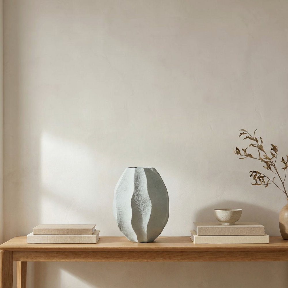 deKor light blue wavy ripple decorative vessel made from Ecomix with a sculptural, textured finish.