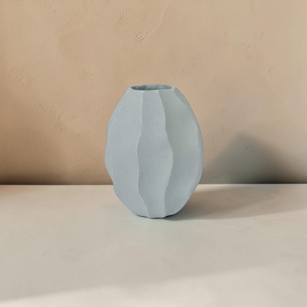 deKor light blue wavy ripple decorative vessel made from Ecomix with a sculptural, textured finish.