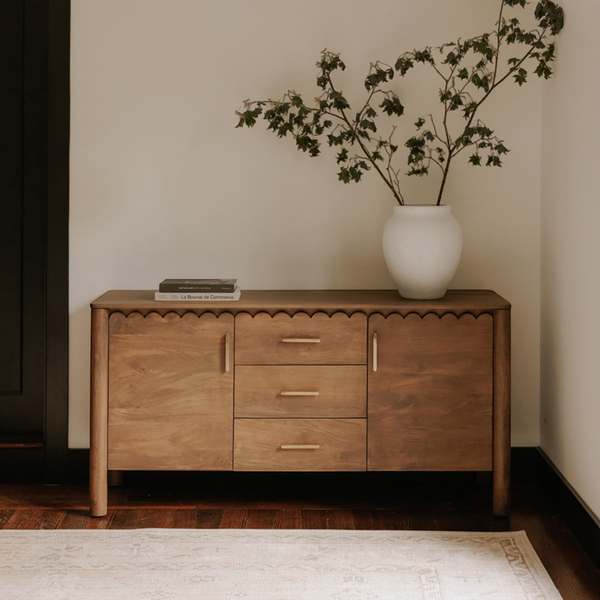 deKor Modern Shaker Sideboard in warm wood with scalloped edges, three central drawers, and brass hardware.