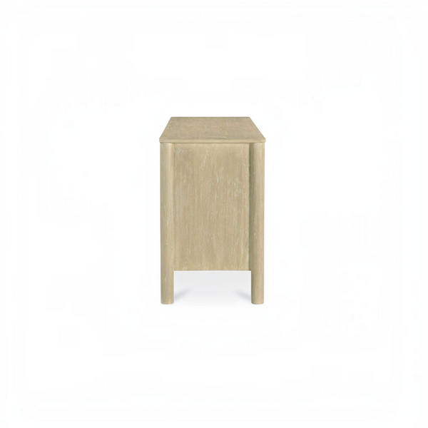 deKor natural wood sideboard with scalloped edge detail and round legs, shown from a side profile view.