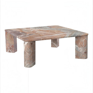 deKor Segment coffee table in orange Levante marble with a smooth surface and unique natural stone striations.